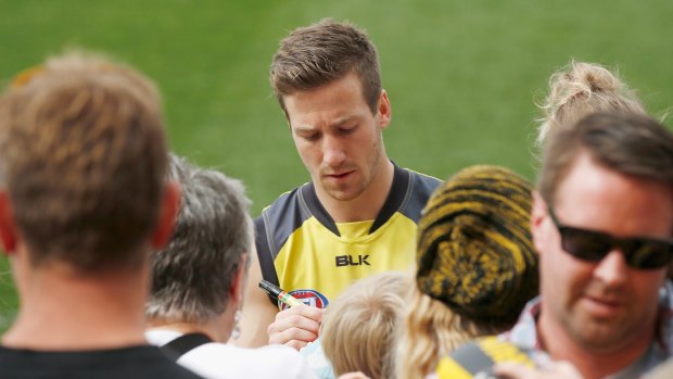 In demand: Kane Lambert signs autographs for Richmond fans.