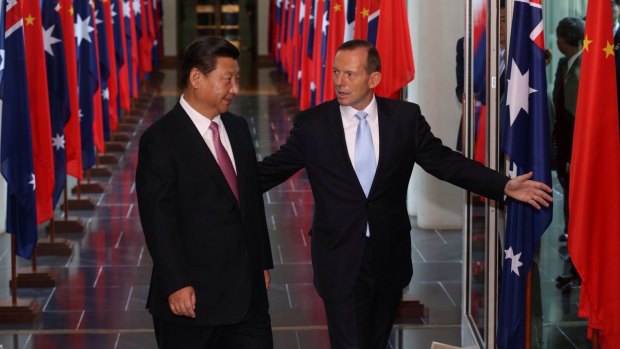 Tony Abbott and Xi Jinping leave the House of Representatives on Monday.