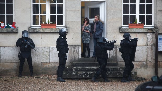 French SWAT officers on patrol near Longpont, north-east of Paris.