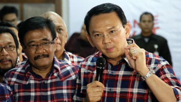 Still running: Ahok, right, with his gubernatorial running mate Djarot Saiful Hidayat, a Muslim, in Jakarta on Wednesday.  