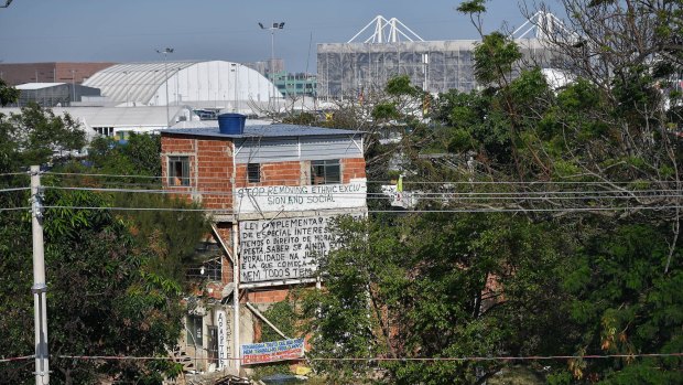 The last original house standing in Vila Autodromo, Olympic Park visible behind it.
