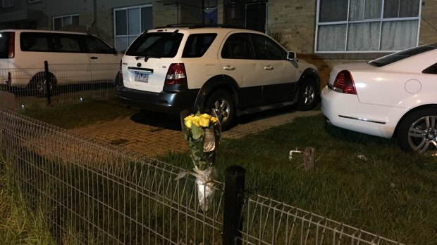 Flowers are left outside the home where Sanaya was staying before her death.