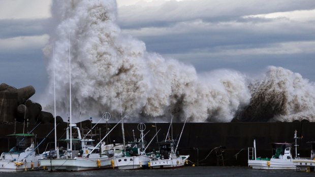 High waves batter the port of Kihou in central Japan on Monday. 