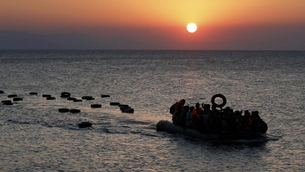 A dinghy overcrowded with Syrian refugees approaches a beach on the Greek island of Kos after crossing part of the Aegean Sea on Thursday.