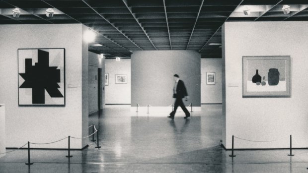 A NGV guard walks past the bare wall where Picasso's Weeping Woman had hung.
