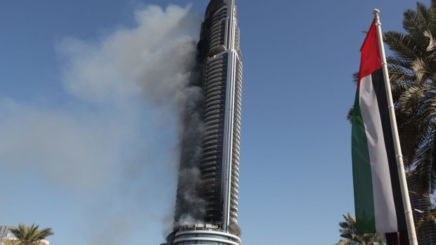 Smoke billows from the Address Downtown skyscraper in Dubai on Friday.