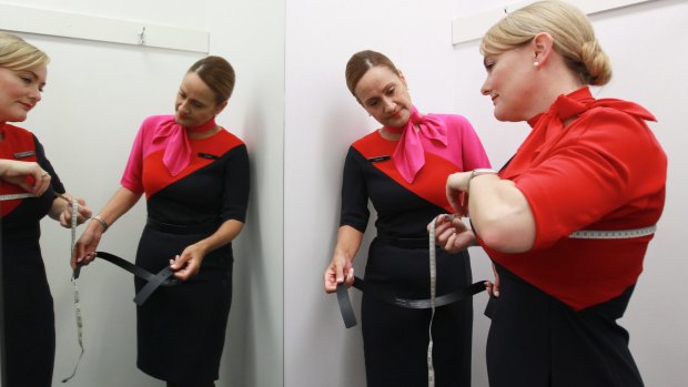 Qantas attendants try out their new uniforms after the current look's introduction in 2013.