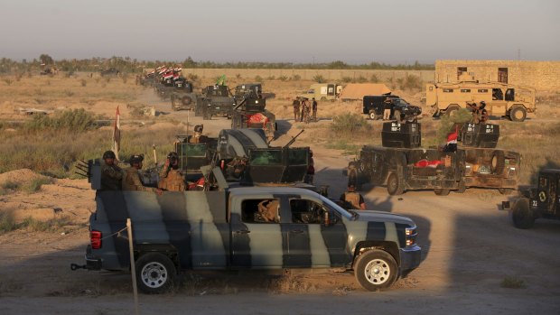 Iraqi military forces mass outside Fallujah ahead of their offensive to retake the city from Islamic State militants.