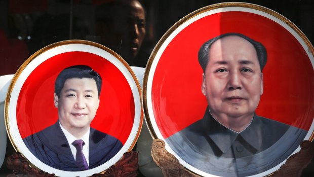 Souvenir plates bearing images of Chinese President Xi Jinping, left, and Mao Zedong  at a shop near Tiananmen Square in Beijing.  