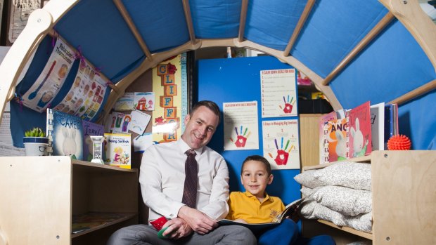 Theodore Primary School principal Matt Holdway with student Will Bourke in a sensory igloo.