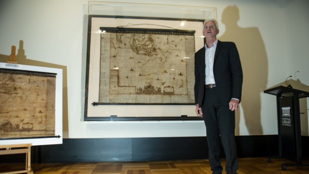 The National Library of Australia's curator of maps, Dr Martin Woods with Archipelagus Orientalis (Eastern Archipelago).