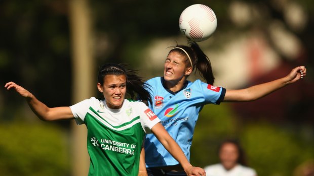 Canberra United defender Rebecca Kiting, left, puts pressure on Sydney FC's Amy Harrison during their 1-0 win earlier this season.