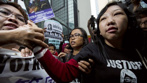 Erwiana Sulistyaningsih is greeted by her supporters outside the Hong Kong court. 