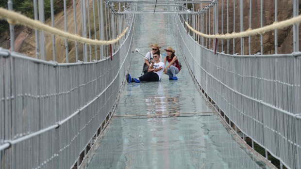 The 300-metre-long glass suspension bridge, with a maximum height of 180 metres, opened to the public last week.