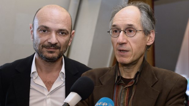 Editor-in-chief of <i>Hebdo</i> Gerard Briard speaks to the press next to the weekly's lawyer Richard Malka.