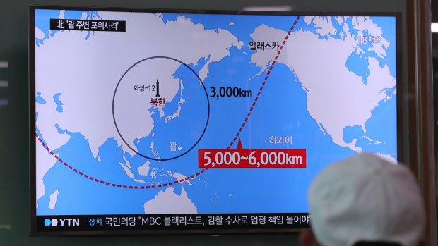 A TV news report on the range of North Korea's missiles at the Seoul Train Station in South Korea.