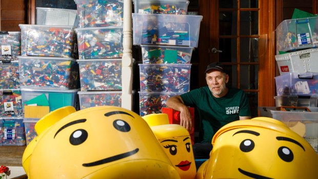 Charlie Bigg-Wither surrounded by tubs of Lego he is selling via the Green Shed for Canberra Hospital Foundation. 