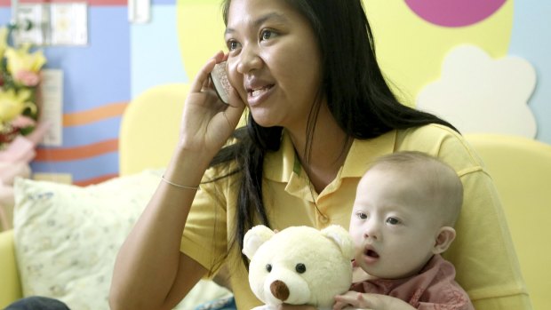 Pattaramon Chanbua with her son Gammy in 2014. The Baby Gammy scandal led to Thailand closing surrogacy clinics.