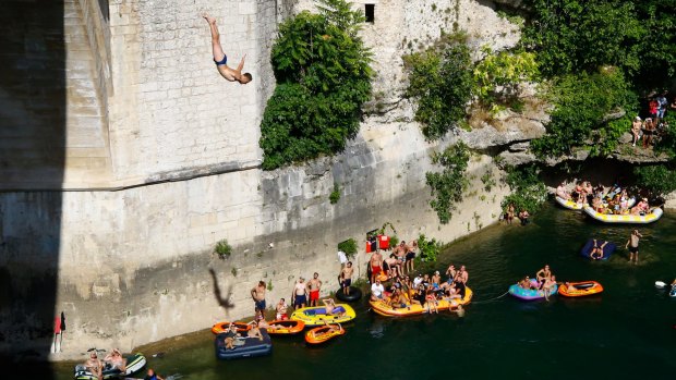 A man jumps from Mostar bridge during 454th traditional diving competition in Mostar.