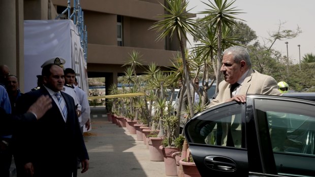 Acting Egyptian Prime Minister Ibrahim Mehleb arrives to visit injured Mexican tourists at a hospital in Cairo.