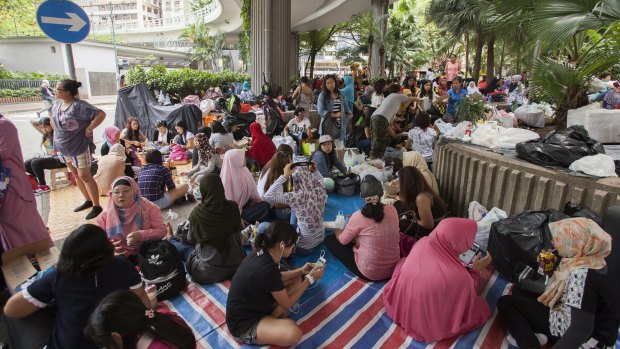 Indonesian domestic helpers gather on their day off in Hong Kong.