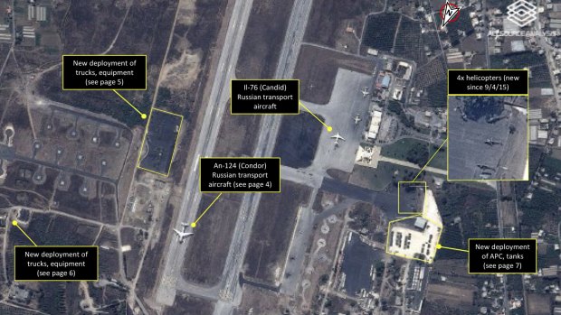 A satellite image shows Russian transport aircraft, helicopters, tanks, trucks and armed personnel carriers at an air base in Latakia in Syria.