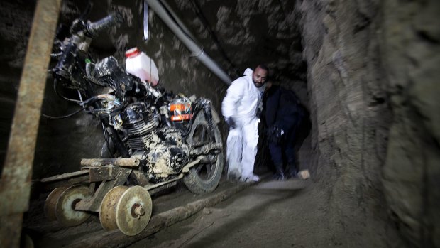 A motorcycle adapted to a rail in the tunnel under the half-built house where drug lord Joaquin "El Chapo" Guzman appears to have made his escape.