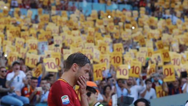 Francesco Totti gets emotional as he salutes his fans after his final game for Roma.