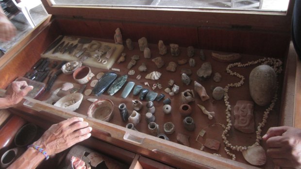 Case of Maya artefacts in museum.