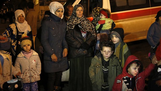 People wait to leave the besieged town of Madaya, northwest of Damascus, Syria. 