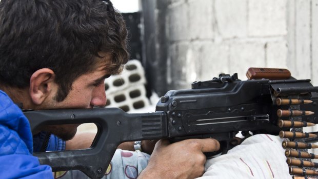 A young Kurdish fighter from the People's Protection Units (YPG) in Kobane, Syria, last year. 