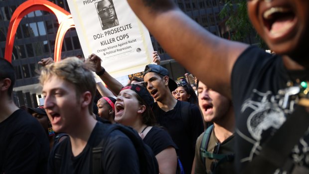 Activists gather to rally against police brutality in Chicago. 