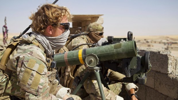Belgian special forces soldiers sit on a rooftop with a guided-missile launcher, a few kilometres east of Tal Afar, Iraq, earlier this month.