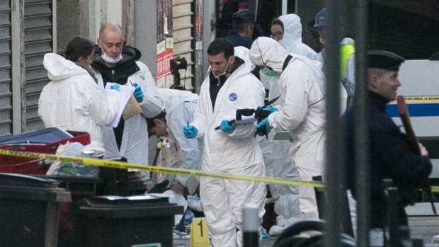 Forensics officers outside 8 Rue du Corbillon in Saint-Denis, Paris, on Wednesday. The bodies of Abdelhamid Abaaoud and Hasna Aitboulahcen have been identified.