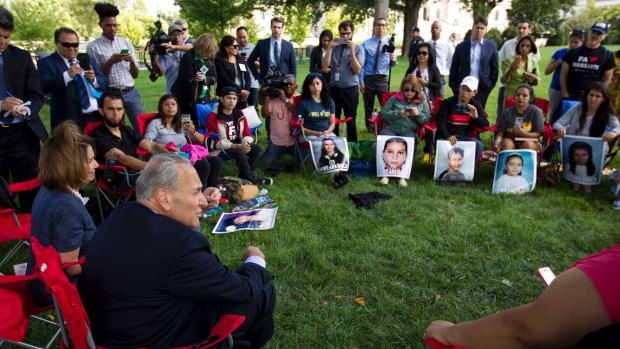 Democrats Nancy Pelosi and Chuck Schumer speak with Dreamers on Capitol Hill in September.