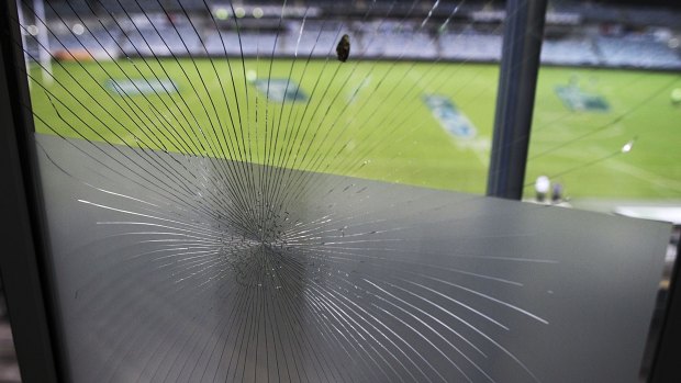 Smashing time: The glass window that fell victim to Michael Cheika.