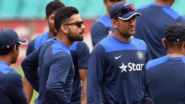 The present and the past: Virat Kohli and M.S. Dhoni at the SCG on Monday.