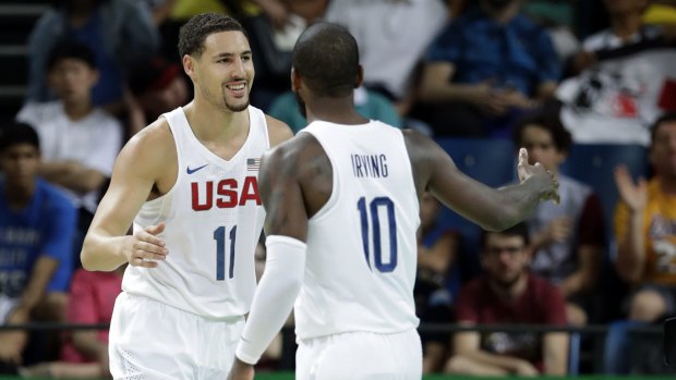 Finding his range: Klay Thompson celebrates with US teammate Kyrie Irving.