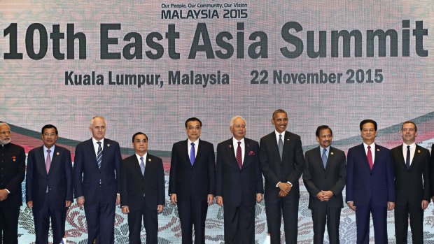 Leaders participate in the East Asia Summit family photo in Kuala Lumpur, Malaysia.