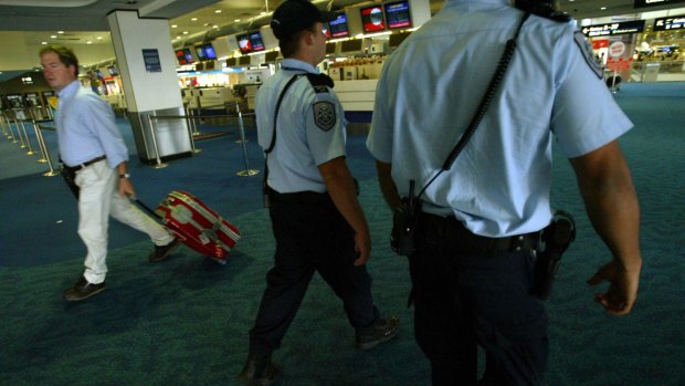 Australian Protective Service officers patrolling Sydney International Airport.