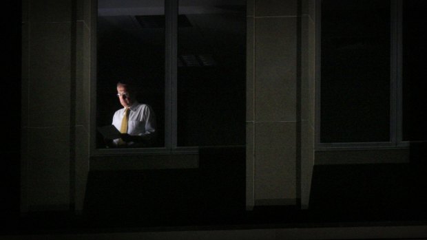 Former treasurer Wayne Swan poses for photographs in the window of the Treasury building in Canberra ahead of the May 2008 budget.