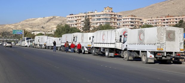 A convoy of humanitarian aid waits in Damascus before making its way into the government besieged rebel-held towns of Madaya, al-Zabadani and al-Moadhamiya.