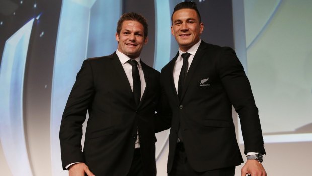 Former teammates: Richie McCaw presents Sonny Bill Williams with his replacement medal, after he gave his original medal to All Blacks fan Charlie Line. 