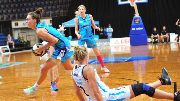 Left, Canberra Capitals player Stephanie Talbot in action on Thursday night. 