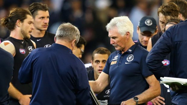 Disappointing: Carlton coach Mick Malthouse talks to his players during a break in the game.