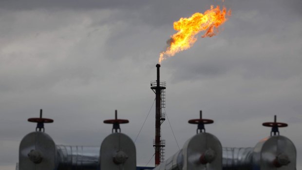 A gas flare at the central processing plant for oil and gas in the Salym oilfields in western Siberia. 