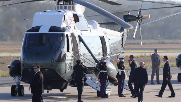 US President Barack Obama salutes as he boards Marine One at RAAF Base Amberley.