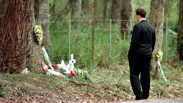 Walter Mikac front of the tree where his daughter was killed at the one-year memorial service of the Port Arthur massacre.