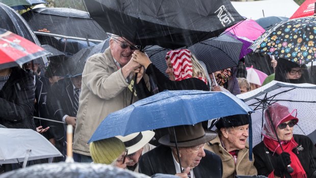 Torrential ran sweeps an Anzac commemoration. 