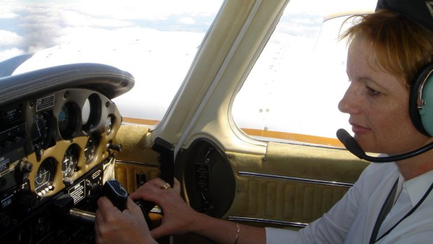 Ms Ley at the controls of her light plane.